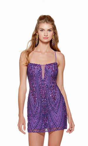 A fun purple short formal dress featuring a plunging neckline, adjustable spaghetti straps, and gorgeous beading throughout. The back has a thin strap lace-up enclosure with beaded tassles at the ends.