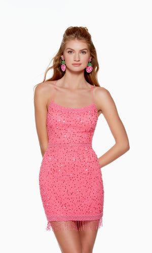 A fun and flirty neon pink short homecoming dress with a scooped neckline and fitted silhouette. The hand-beaded embellishments and fringe detail at the hem take this dress to the next level.