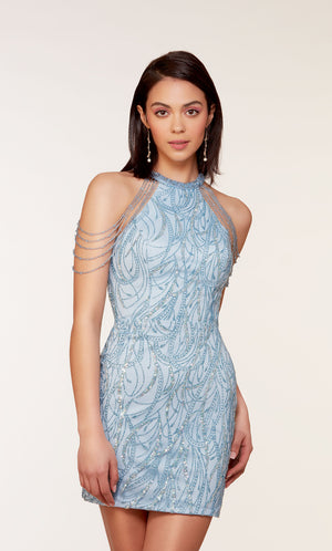 A unique short glacier blue dress featuring golden glitter embellishments, a high neckline, and hand-beaded accents.