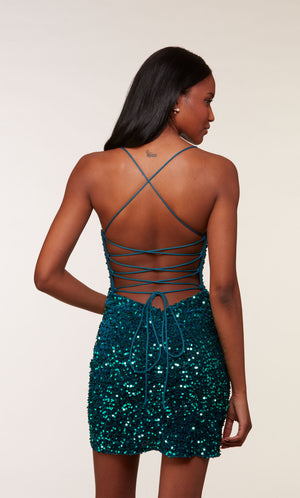 A fitted, green-blue sequin short corset dress with a strappy back, and zip-up side slit.