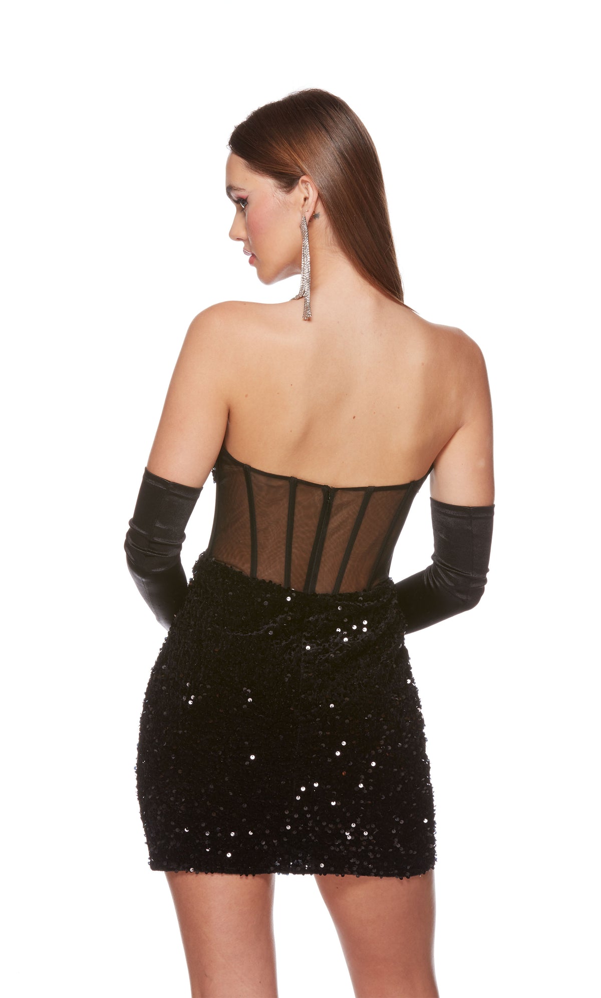 A glamorous corset top dress featuring a strapless zip-up back and sheer bodice, in black plush sequins. The dress was accessorized with long black satin gloves which are not included with dress purchase.