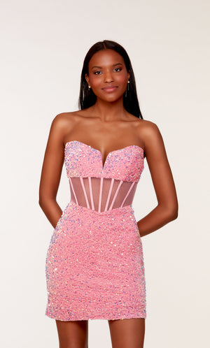 A glamorous corset top dress featuring a strapless sweetheart neckline and sheer bodice, in bubblegum pink colored plush sequins.
