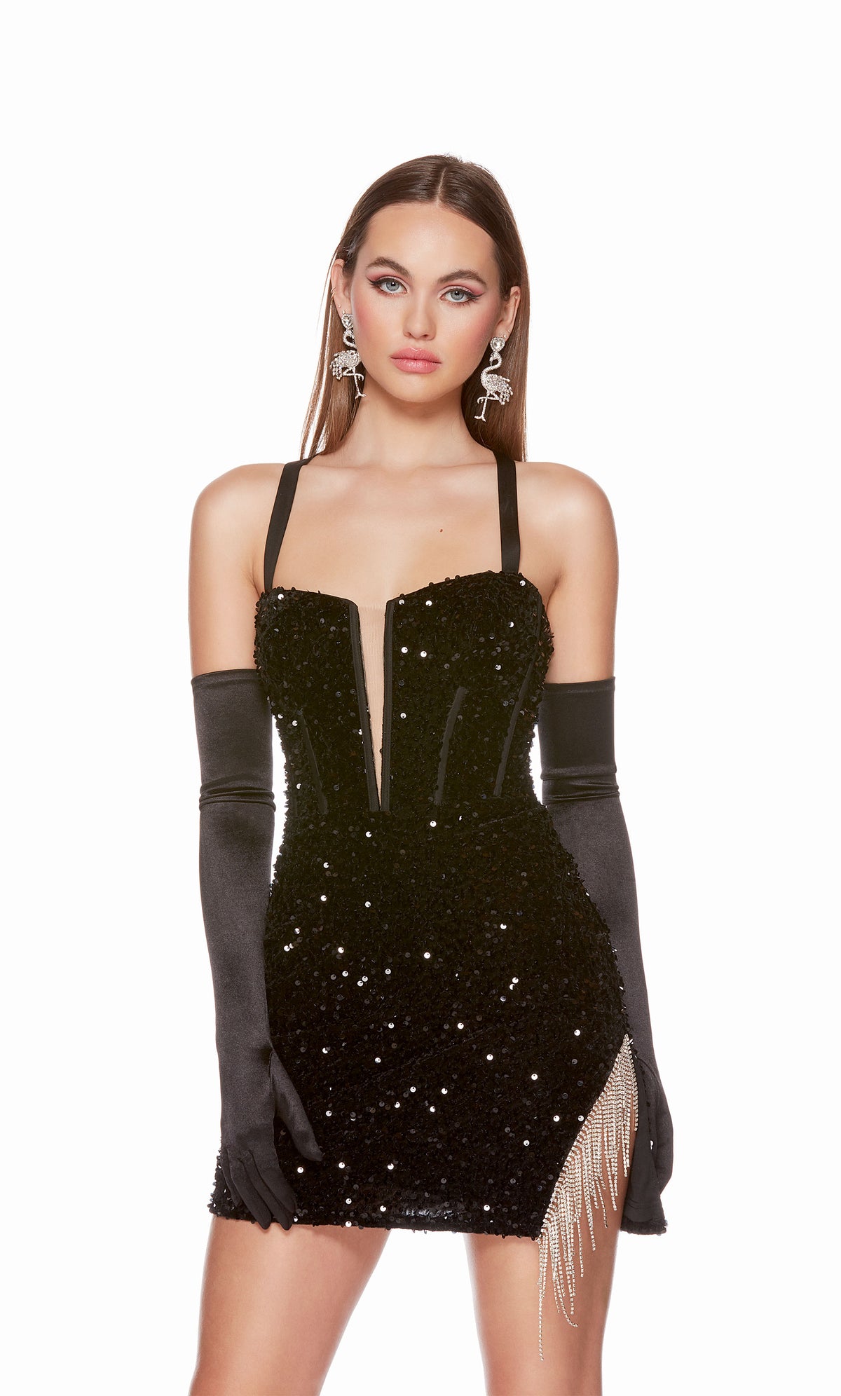A playful, plunging neckline black sequin corset dress highlighting a side slit adorned with sparkly silver fringe and a lace-up back, for the perfect fit. The dress was accessorized with long black satin gloves which are not included with dress purchase.