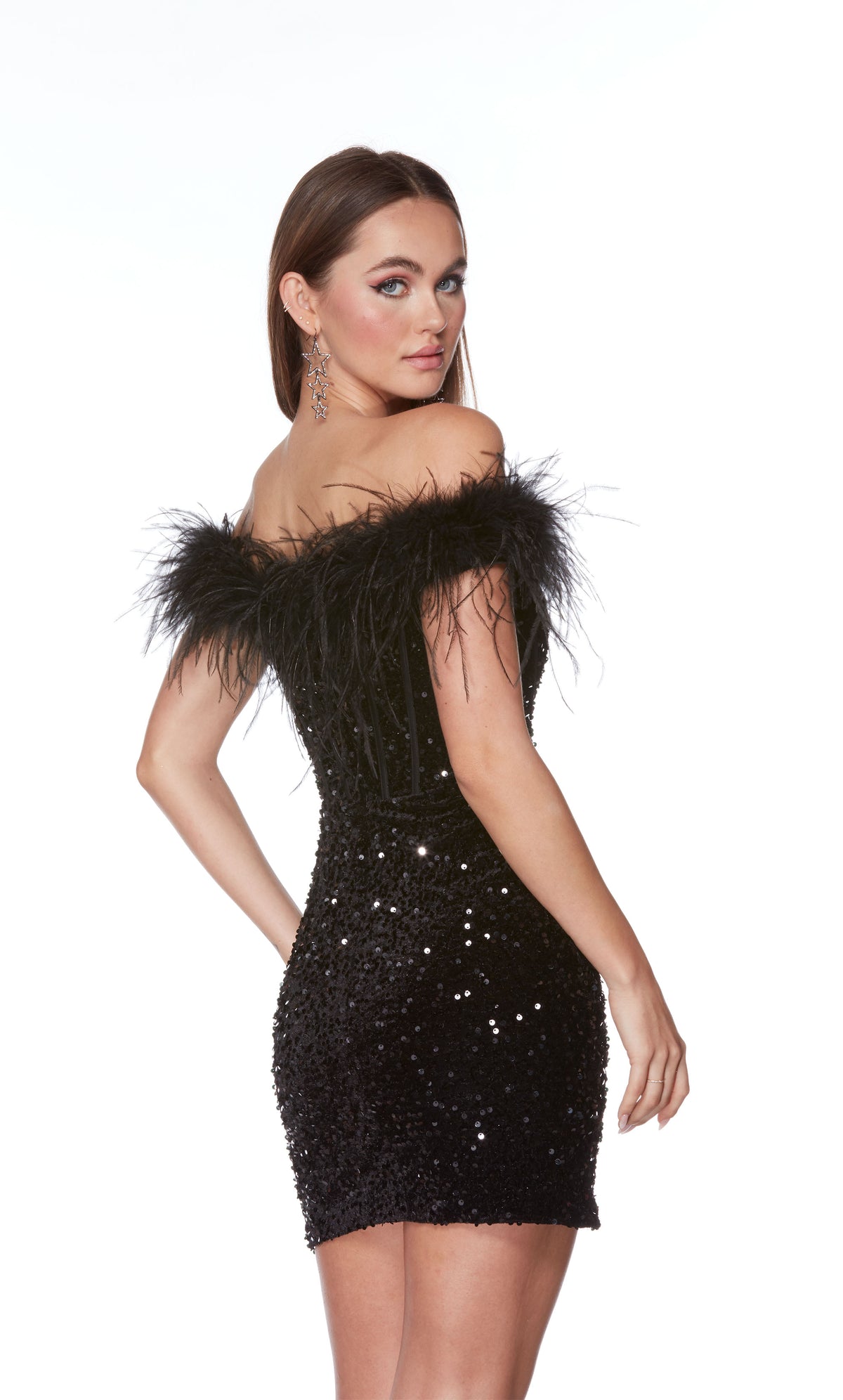 An off-the-shoulder, plunging neckline mini dress with a corset bodice with a zip-up back and feather trim in black plush sequins.