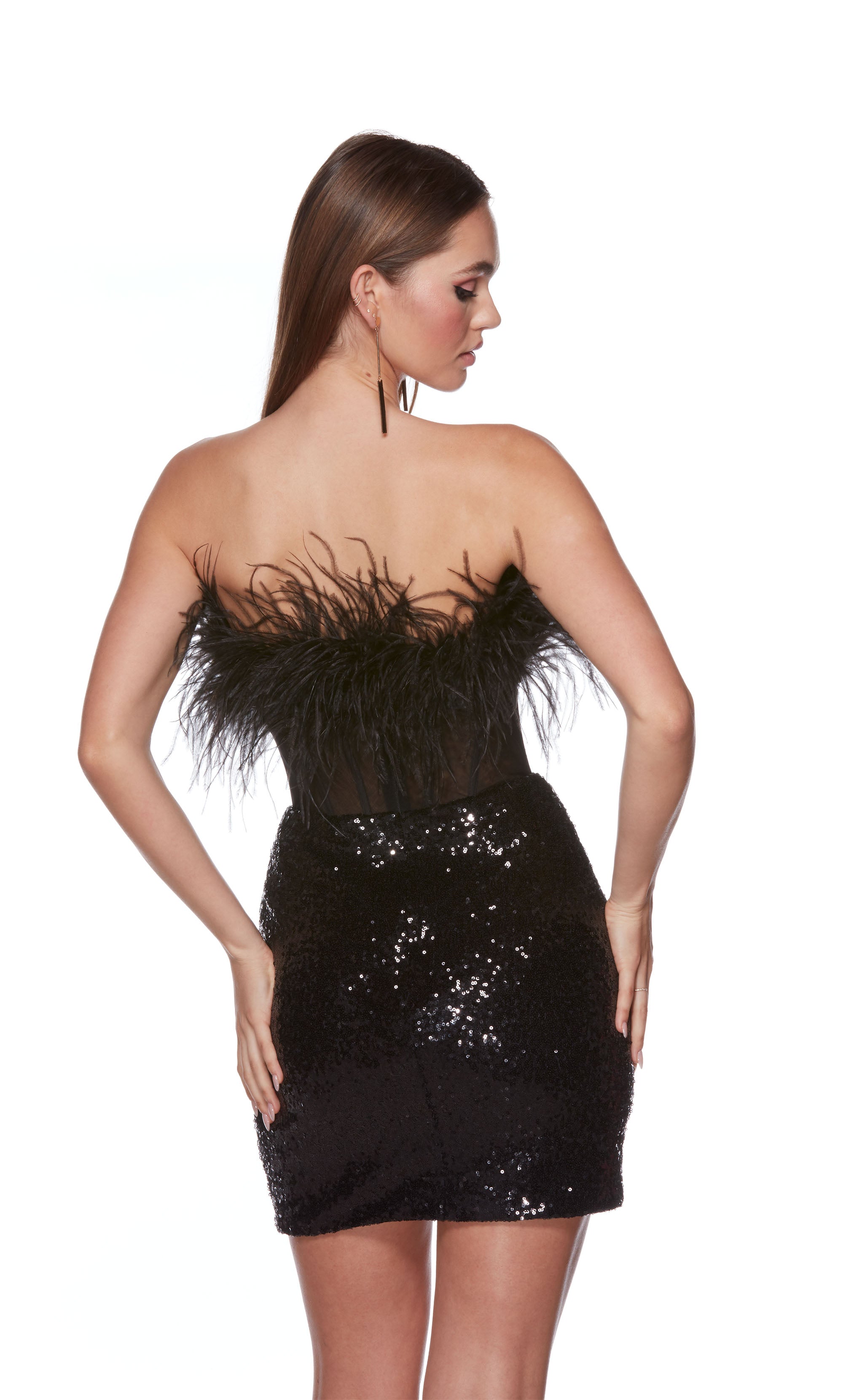 A chic, feather dress with a strapless corset bodice and fitted sequin skirt in black.