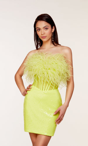 A chic, feather dress with a strapless corset bodice and fitted sequin skirt in neon yellow.