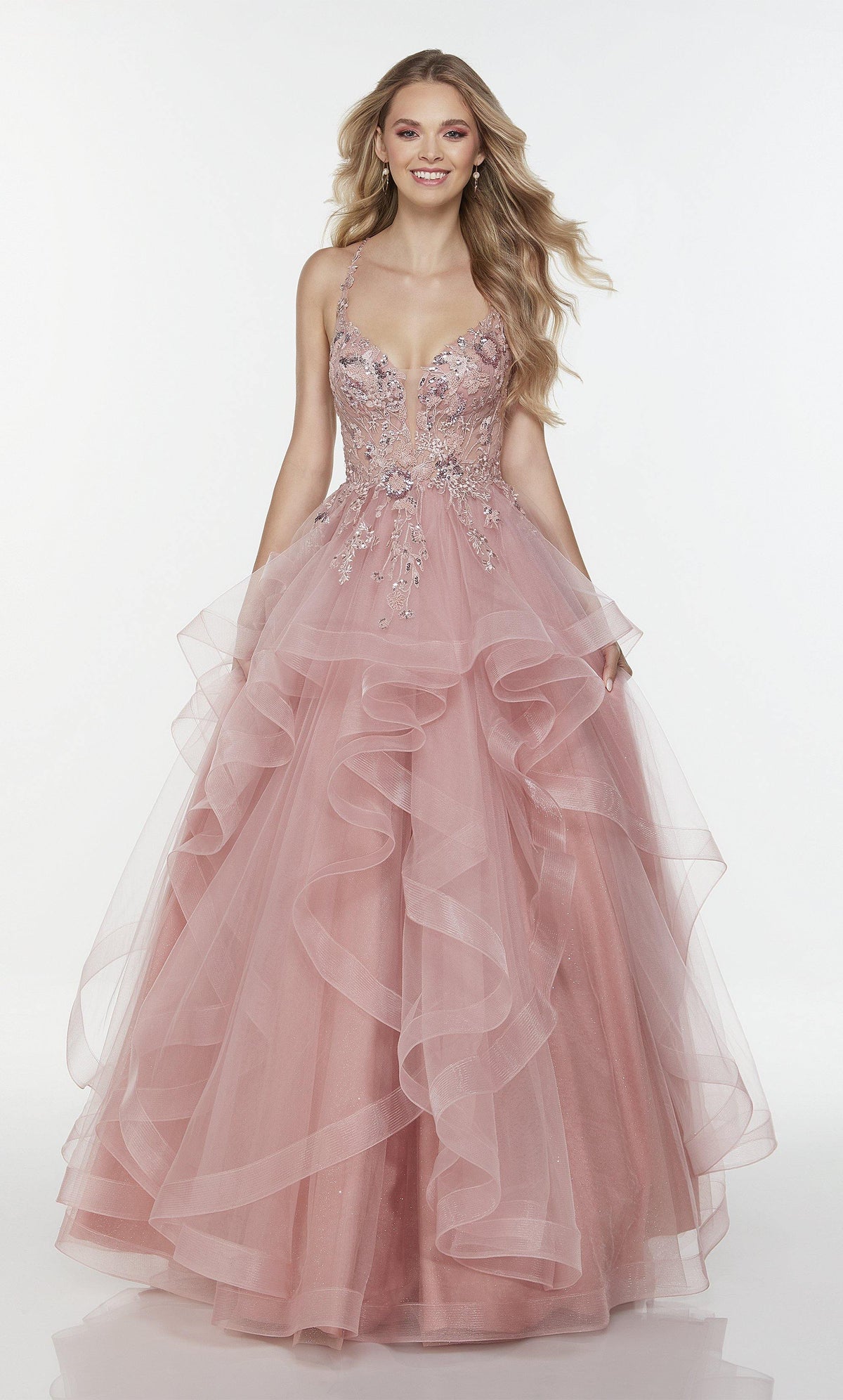 Pink prom dress with a plunging neckline, sheer bodice, layered tulle skirt, and lace appliques.