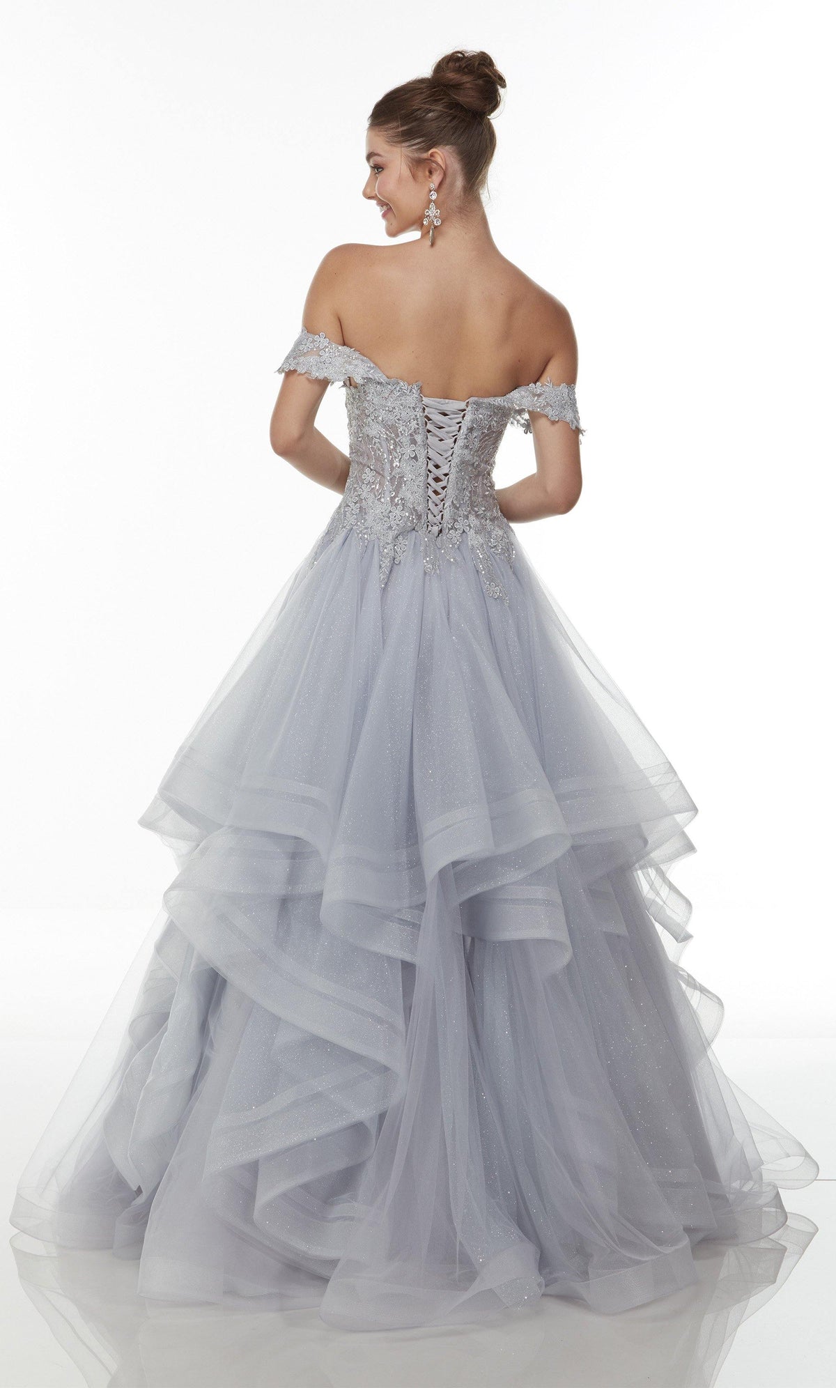 Off-the-shoulder ball gown with a lace-up, corset bodice and sparkly, layered tulle skirt in silver.