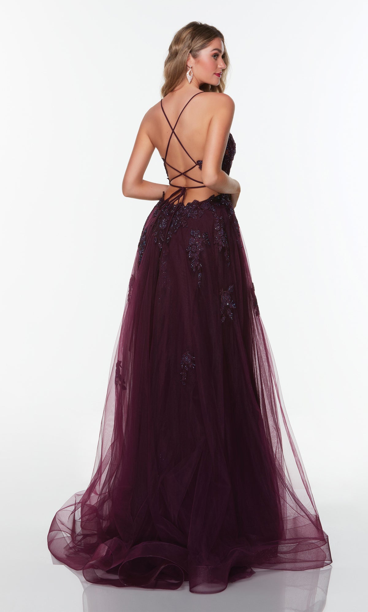 Tulle prom dress with a strappy back, floral appliques, and train in black plum.
