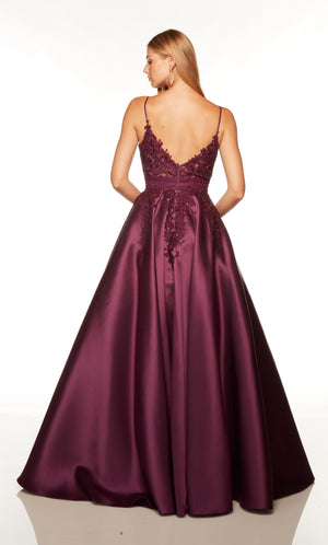 Elegant prom dress with a V shaped back style and floral lace appliques in purple.