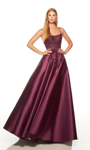 Elegant formal dress with a scoop neckline and floral lace appliques in black plum color.