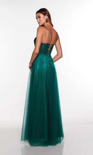 A line green dress with a sheer lace up bodice.