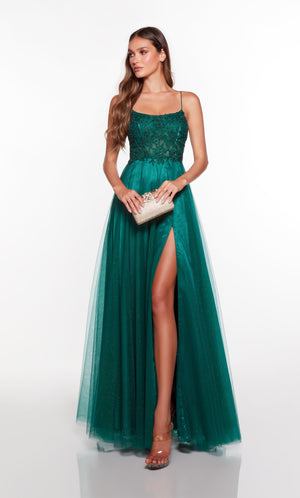 A line corset prom dress with a sheer lace corset bodice and front slit in green.