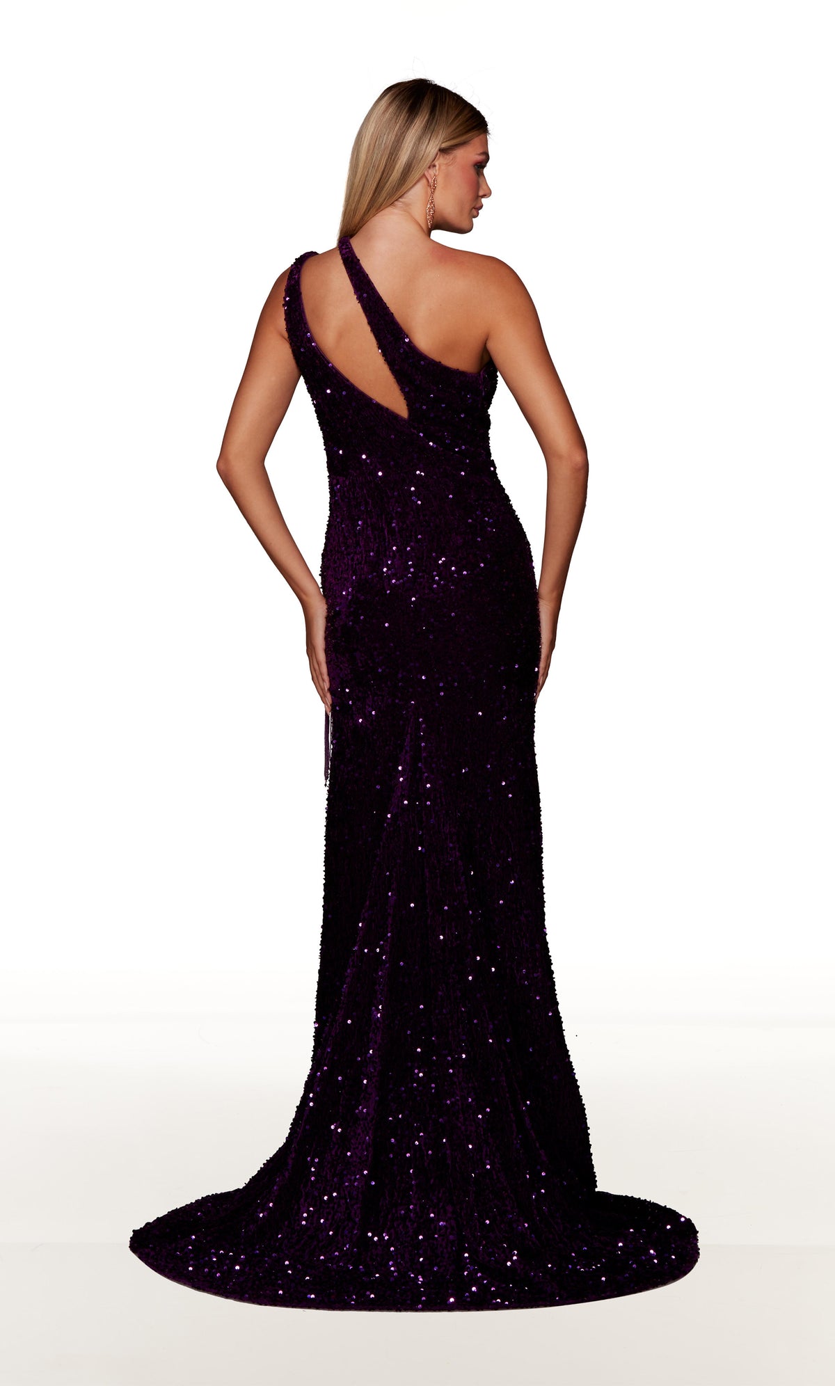 Purple one shoulder prom dress with cutout, high slit with fringe detail, and train.