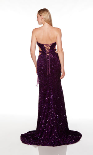 Long purple prom dress with a lace up back, fringed side slit, and train.