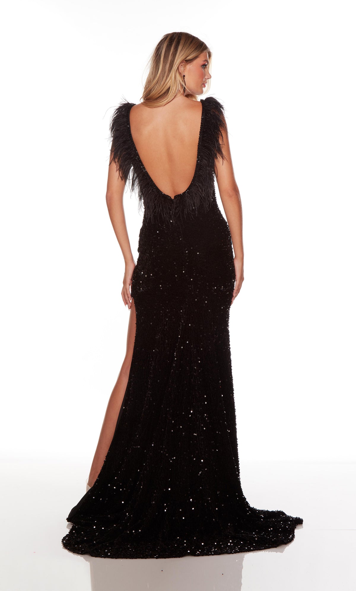 Long black formal dress with a U shaped feather trimmed back, high side slit, and train.