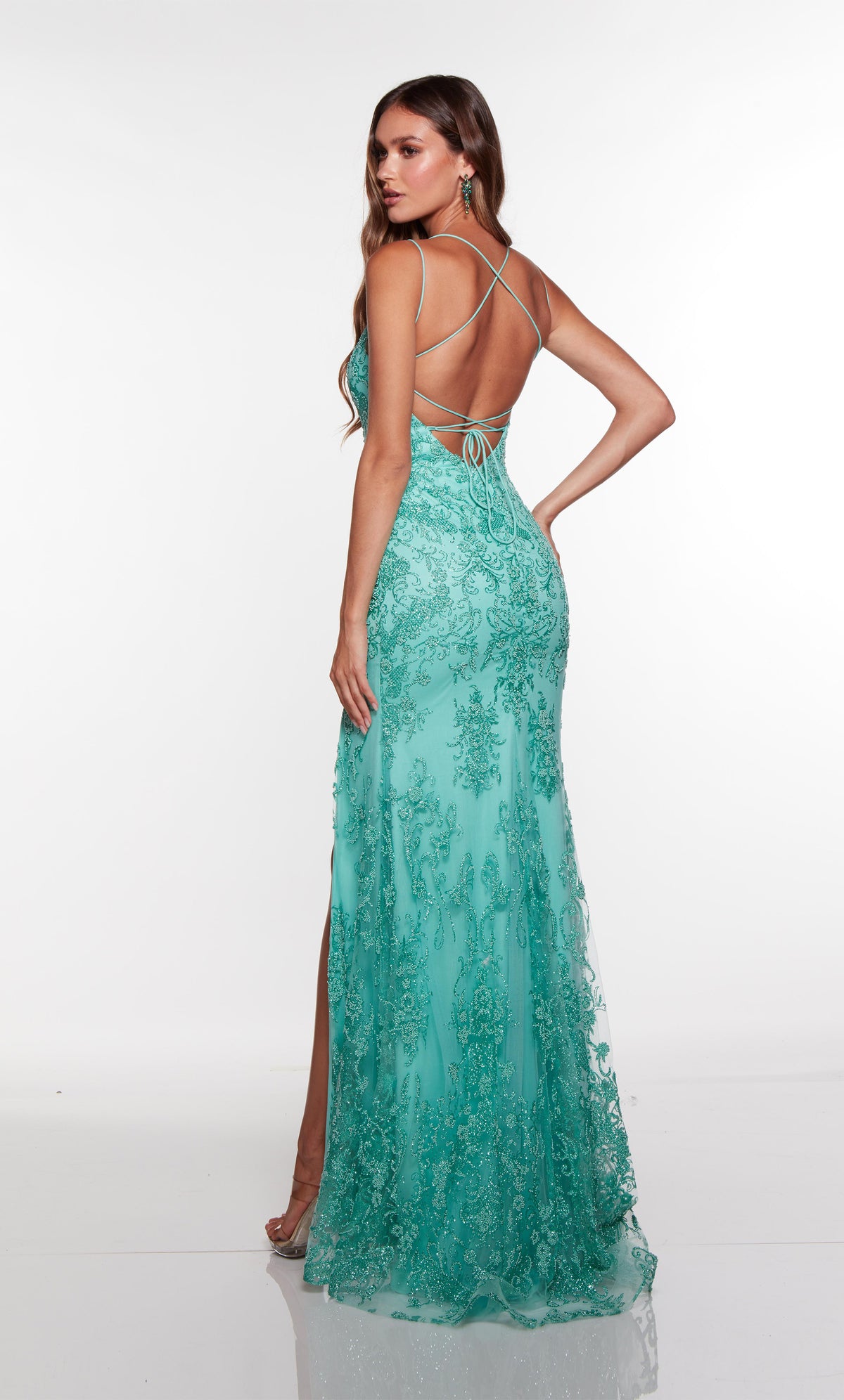 Jade lace prom dress with a strappy open back and train.