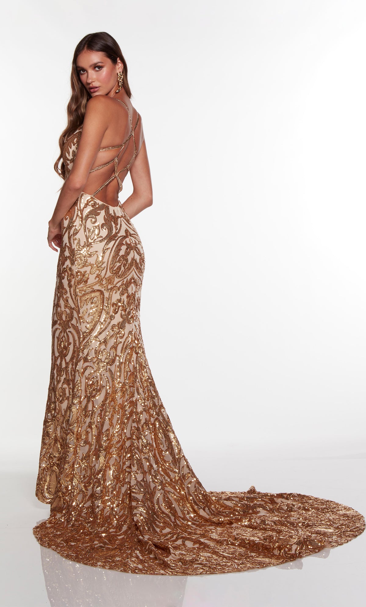 Elegant prom dress with a cut out back and long train in gold sequins.
