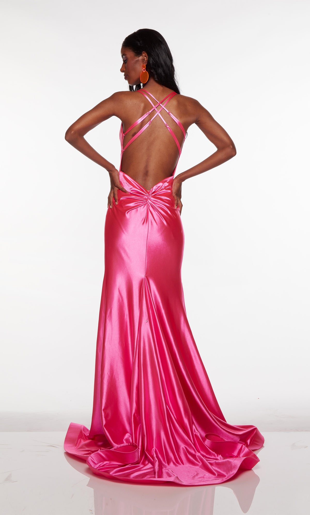 Pink satin gown with a crisscross back and long train.