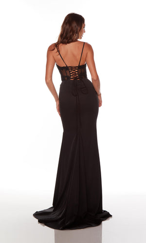 Fitted black corset prom dress with a sheer lace up bodice and train.