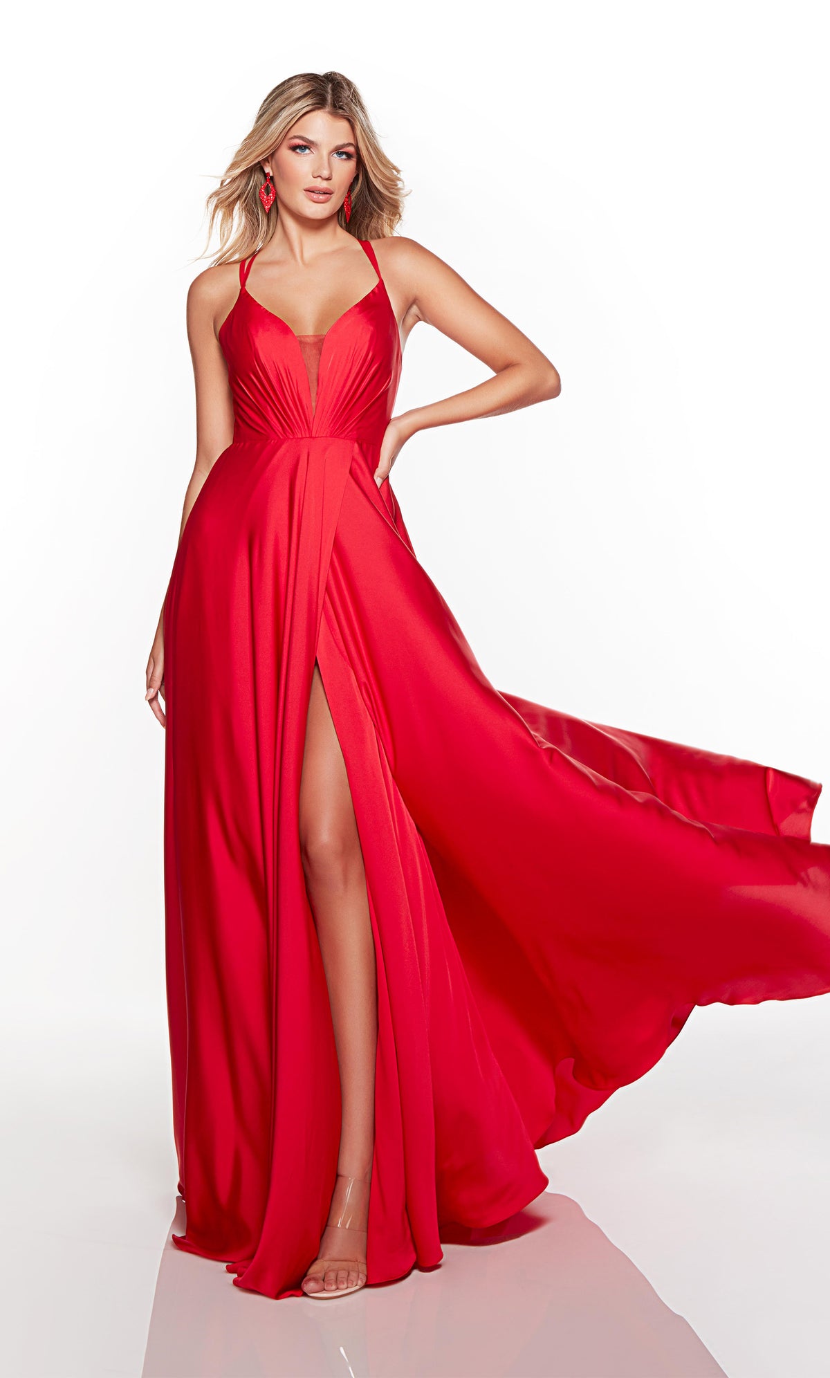 Flowy red formal dress with a plunging neckline and front slit.