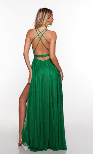Sparkly prom dress with a strappy back and high slit in green.