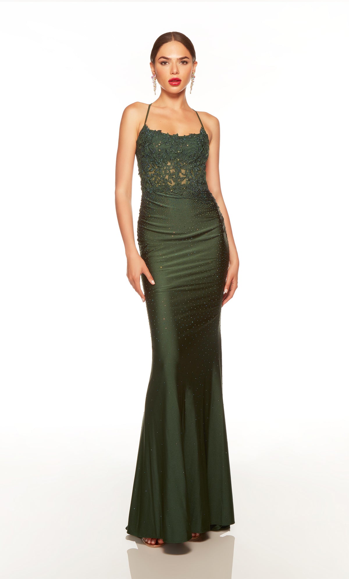 Fitted green corset dress with a sheer lace bodice and heat set stone detail throughout. 