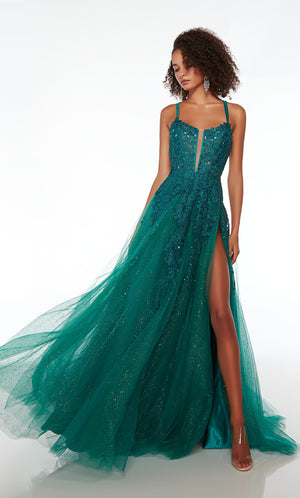 Green prom dress: Plunging corset top, high slit, crisscross strappy back, and train in glitter tulle fabric. Floral lace appliques strategically placed for the perfect touch.