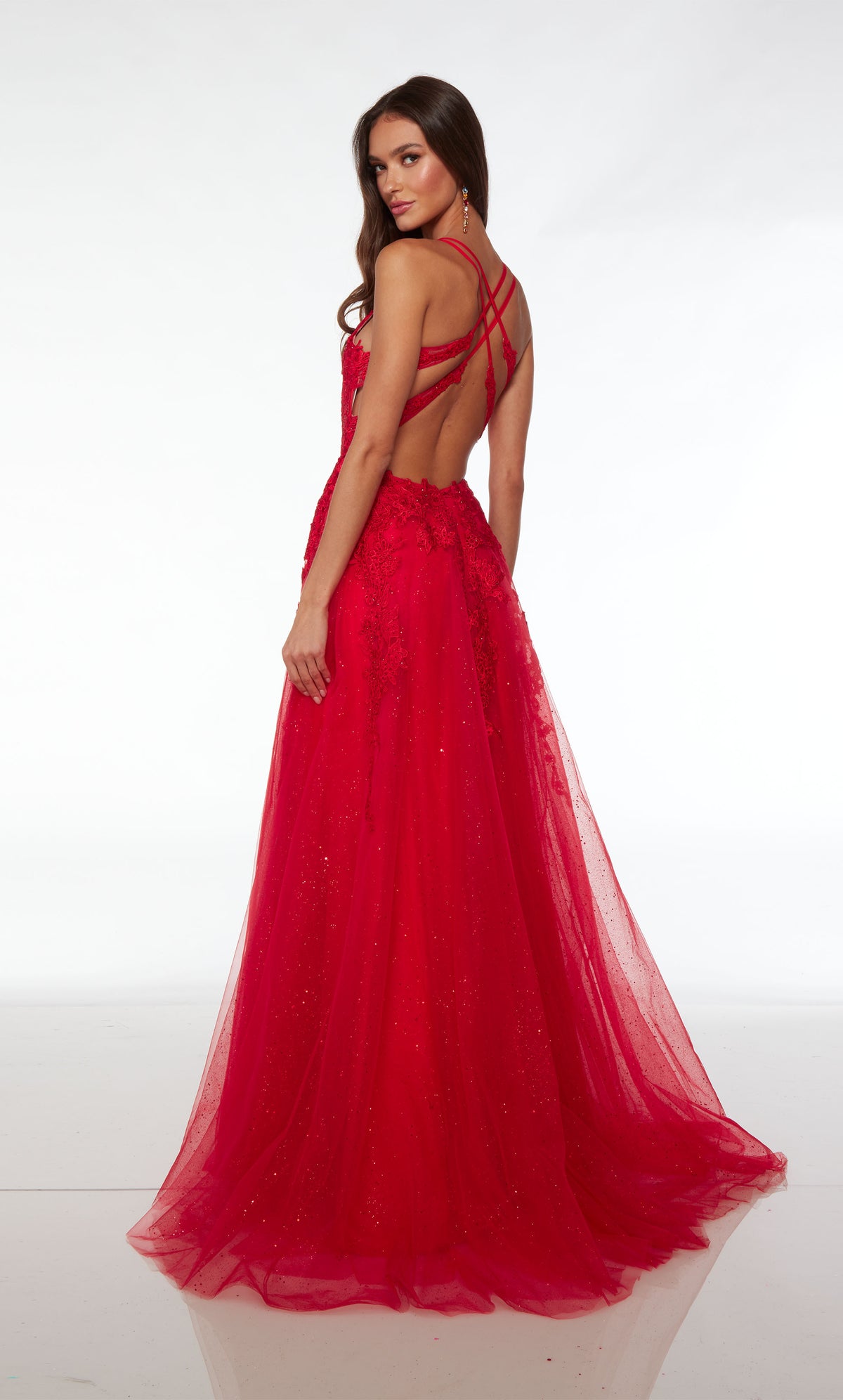 Red prom dress: Plunging corset top, high slit, crisscross strappy back, and train in glitter tulle fabric. Floral lace appliques strategically placed for the perfect touch.