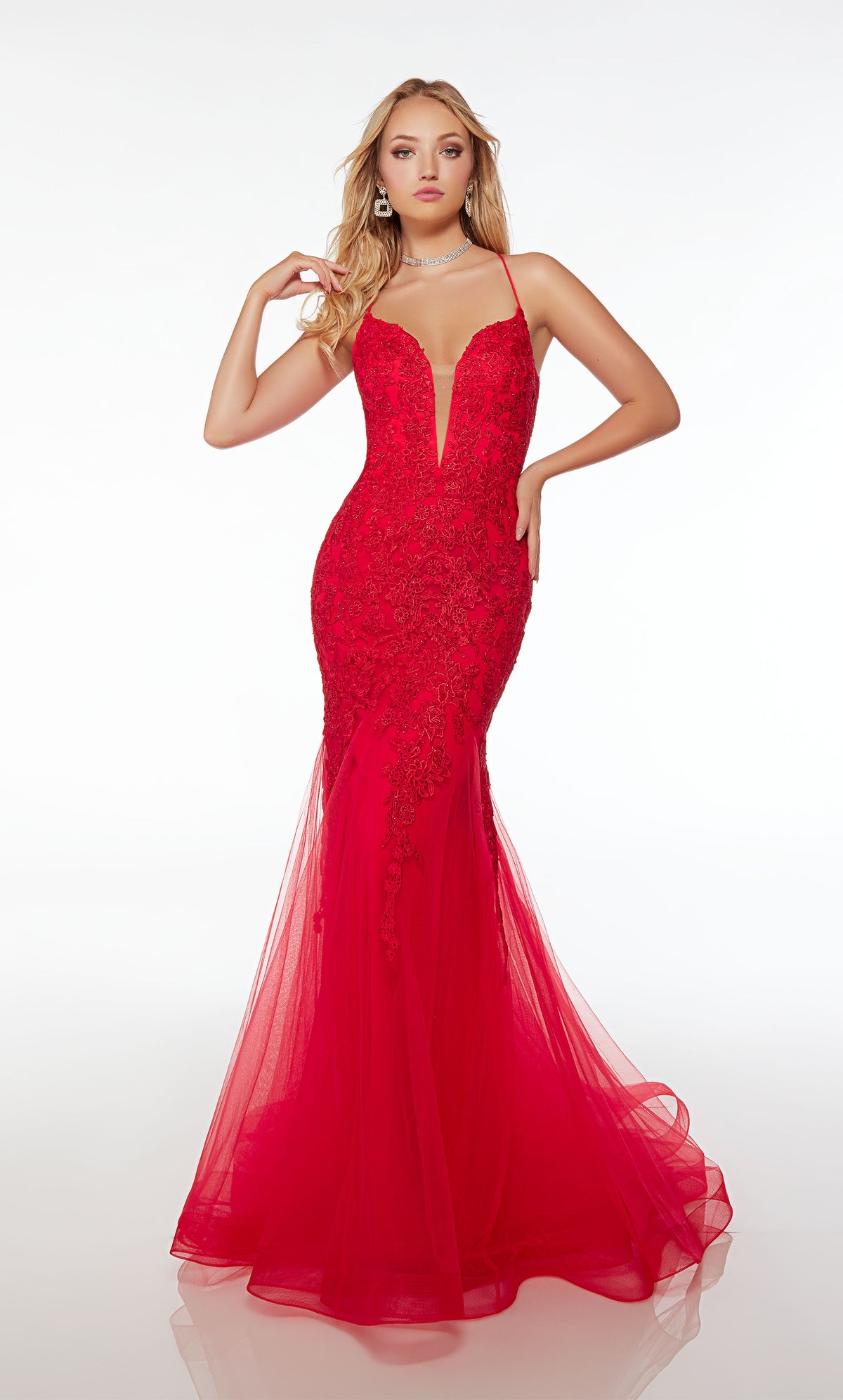 Red mermaid dress with plunging neckline, crisscross lace-up back, and an slight train crafted in tulle and adorned with delicate beaded lace for an elegant and captivating look.