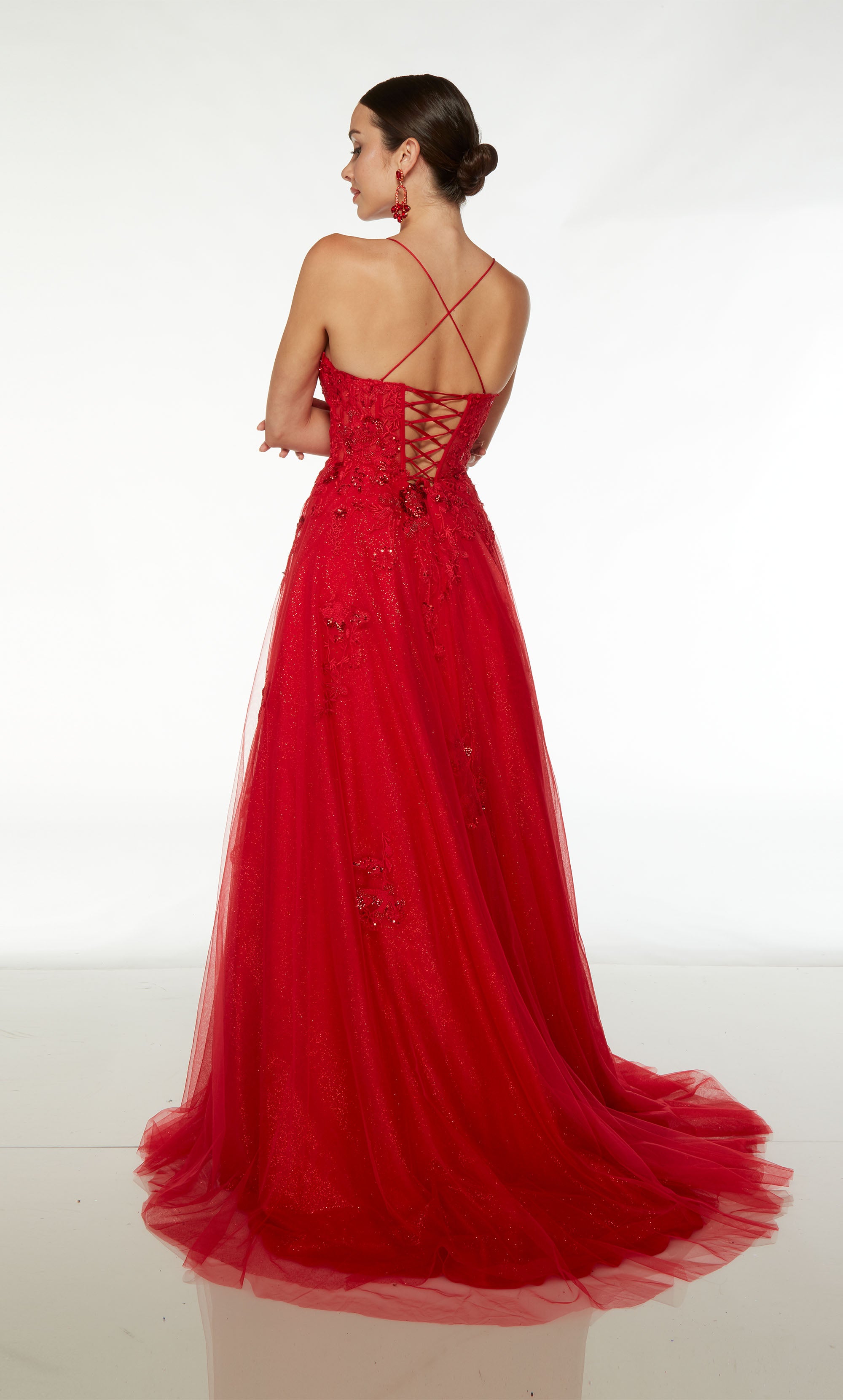 Red prom dress: Scooped neckline, A-line skirt, crisscross lace up back, and train crafted in glitter tulle and adorned with delicate beaded lace.