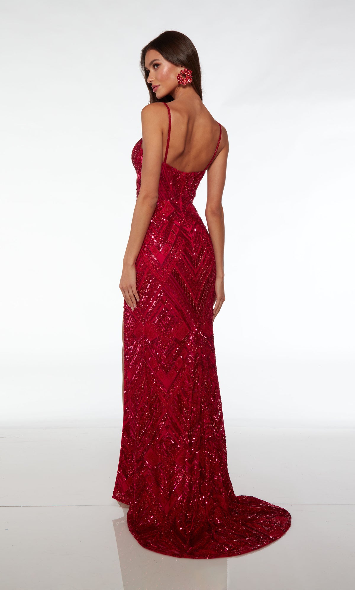 Red hand-beaded unique prom dress with intricate pattern, plunging neckline, side slit, beaded straps, and an slight train for an stylish and distinctive look.