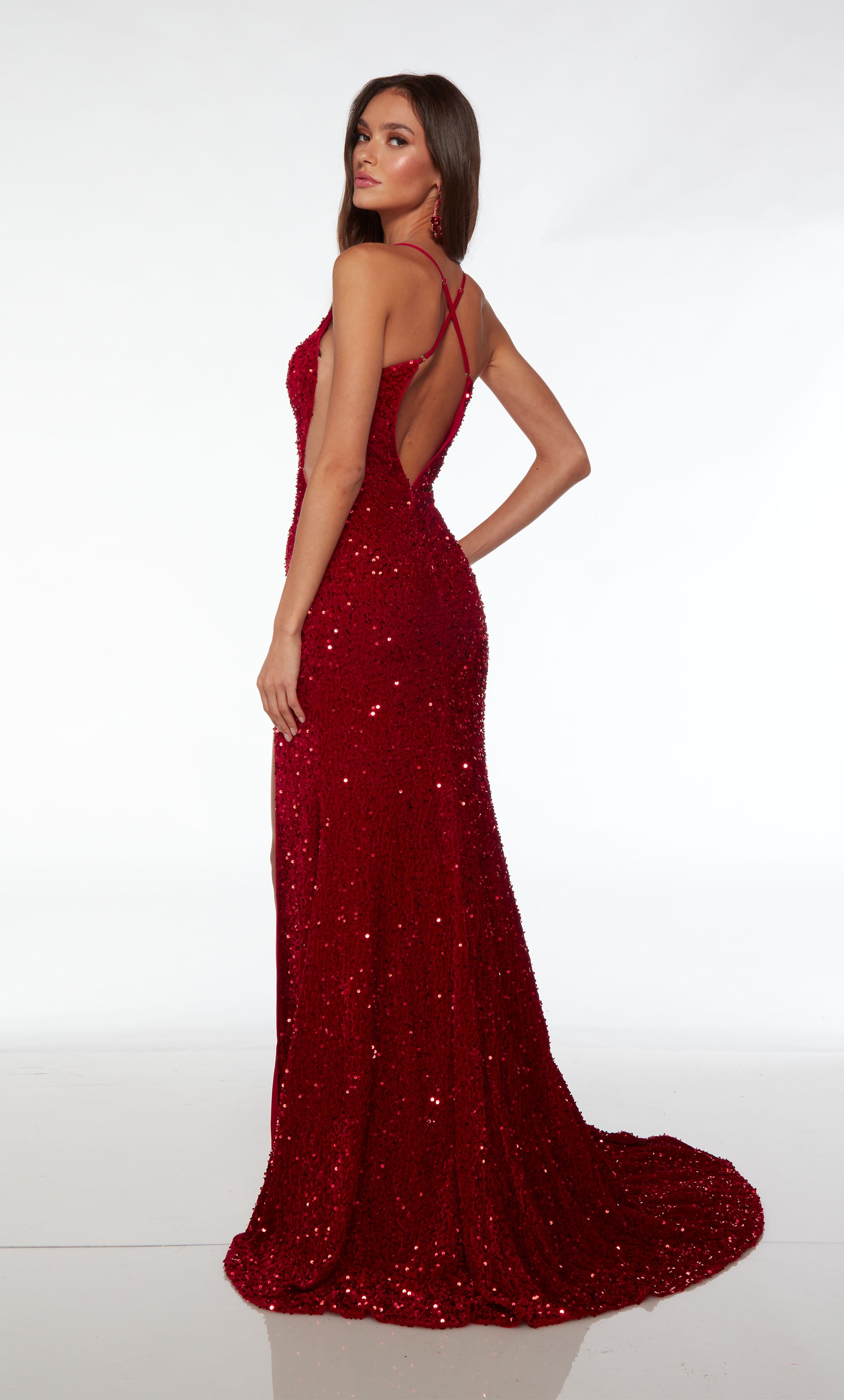 Plunging sequin dress: High slit, illusion side cutouts, crisscross keyhole back, and an gorgeous train for an stunning and captivating ensemble.