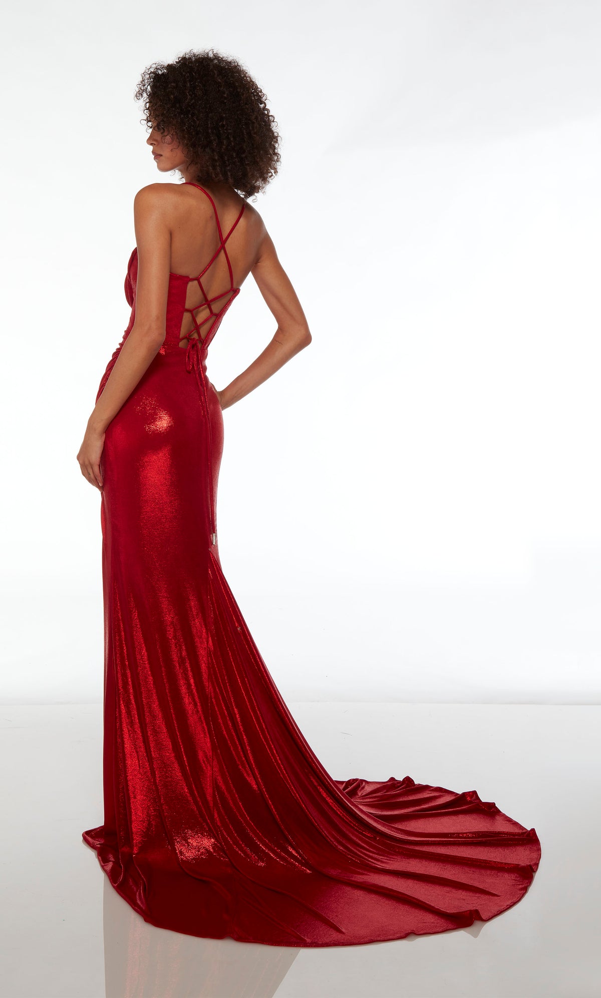 Red unique prom dress featuring an sweetheart-cowl neckline, corset top, high slit, lace-up back, and train, crafted in an metallic stretch fabric.