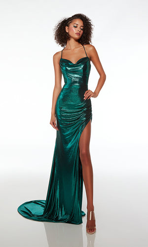 Green unique prom dress featuring an sweetheart-cowl neckline, side slit, ruching detail, strappy lace up back, and train, crafted in an metallic stretch fabric.