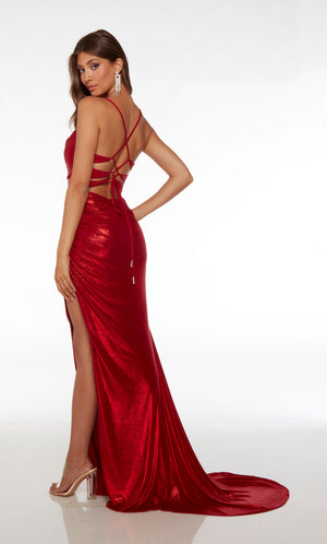Sparkly red prom dress featuring an sweetheart-cowl neckline, side slit, ruching detail, strappy lace up back, and train, crafted in an metallic stretch fabric.