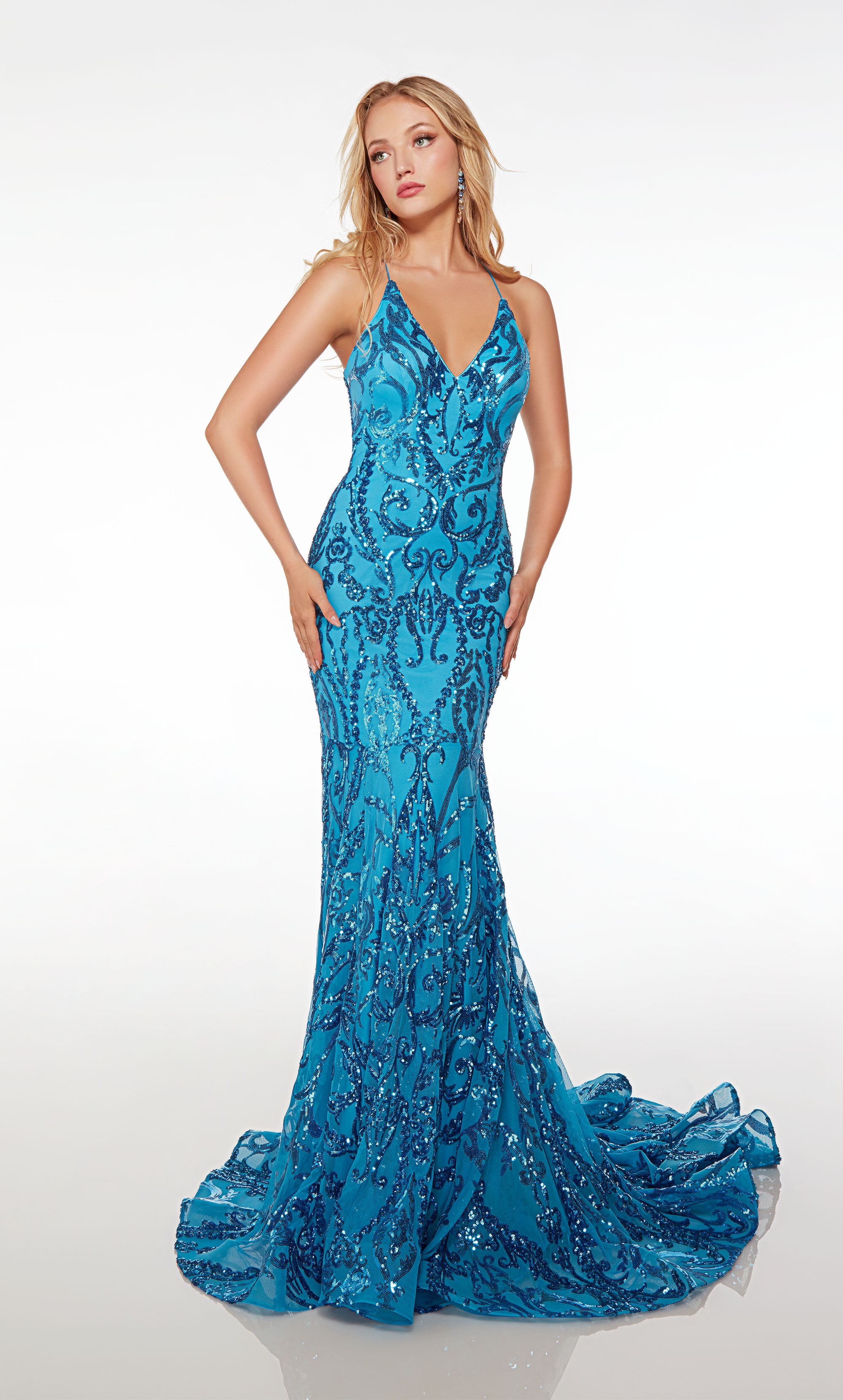Glamorous fit-and-flare prom dress in blue paisley sequin fabric, showcasing an captivating V-neckline and an stylish strappy back.