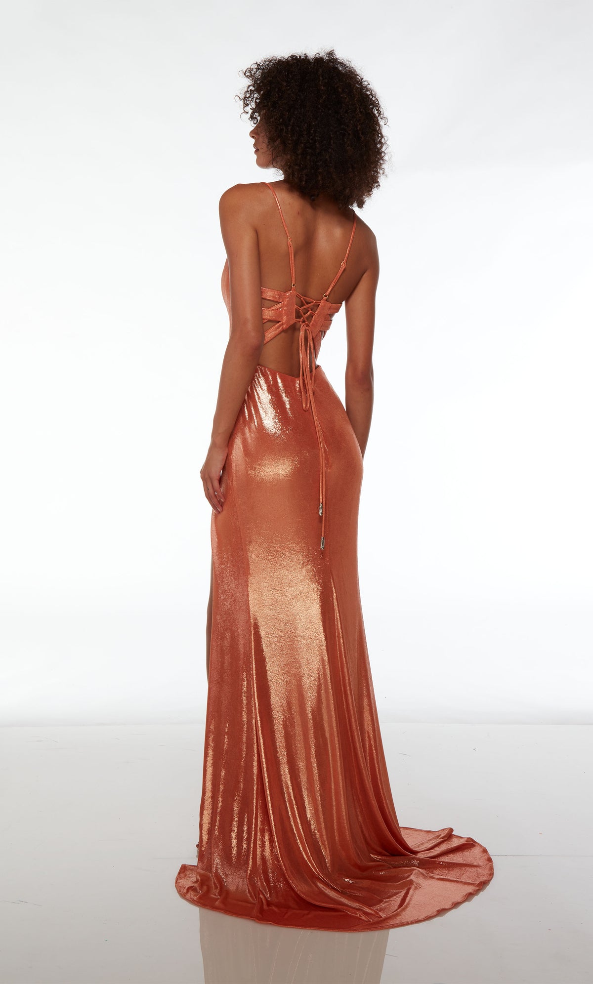 Elegant copper-colored metallic stretch formal dress with an plunging neckline, side slit, lace-up back, and an graceful train for an stylish and sophisticated look.