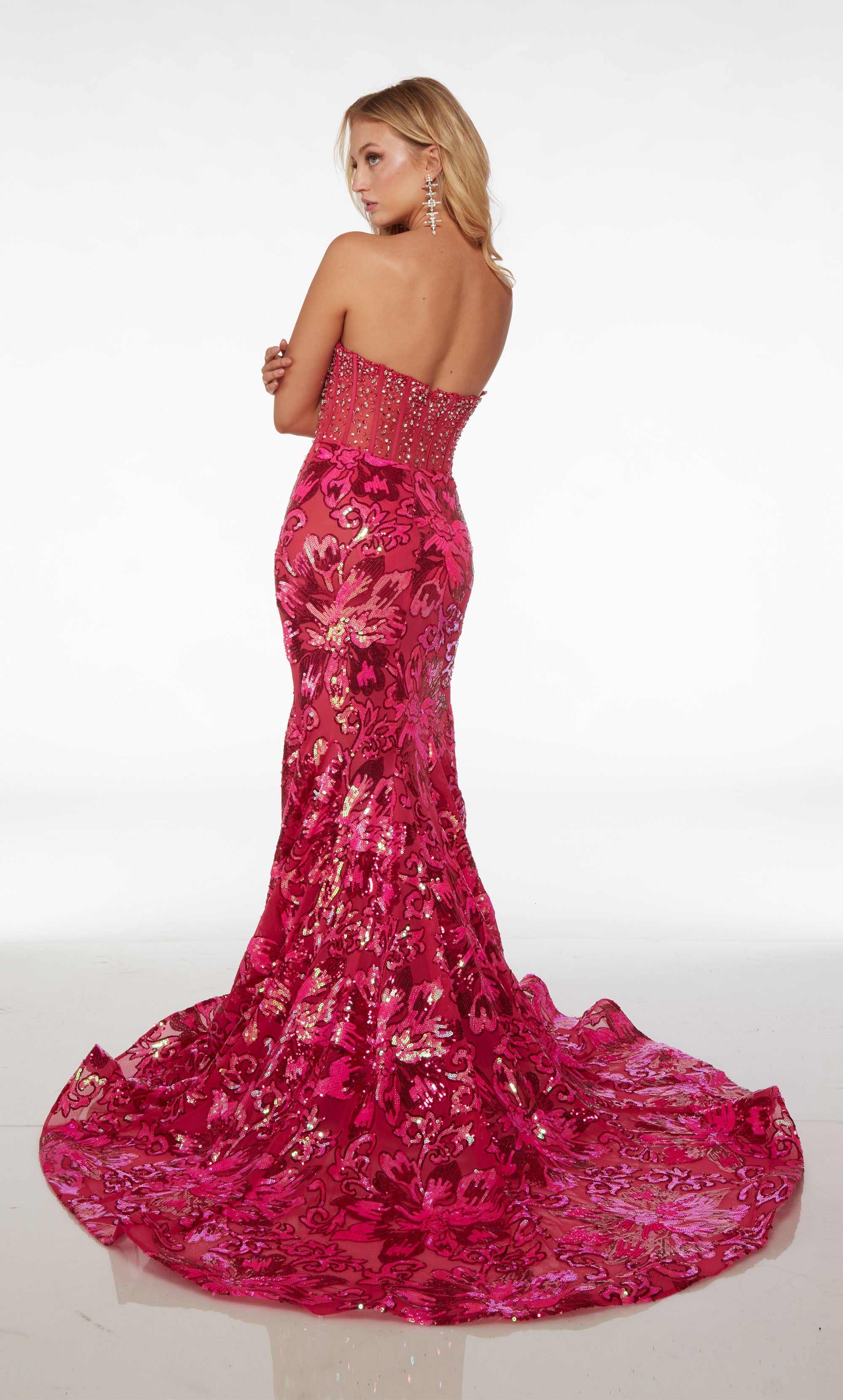 Stunning strapless mermaid dress featuring an sheer rhinestone-embellished corset top and an floral sequin skirt with an gracefully long train.