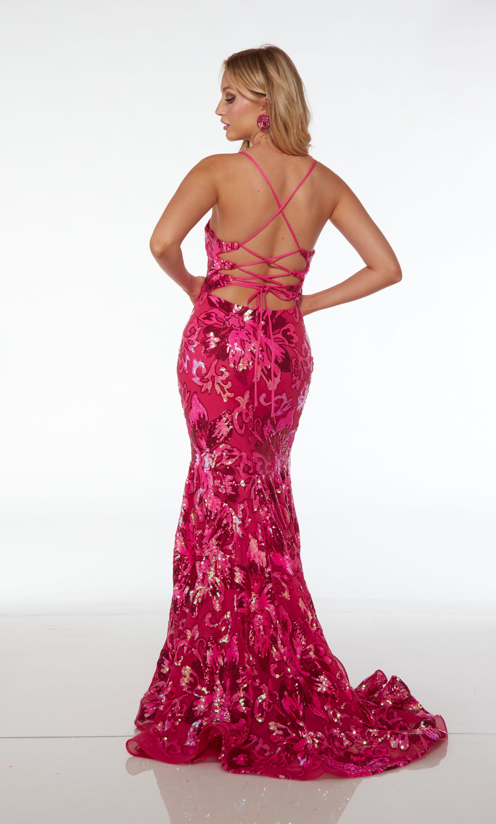 Captivating pink mermaid dress adorned with an floral sequin design, plunging neckline, strappy lace-up back, and an stylish train for an glamorous look.