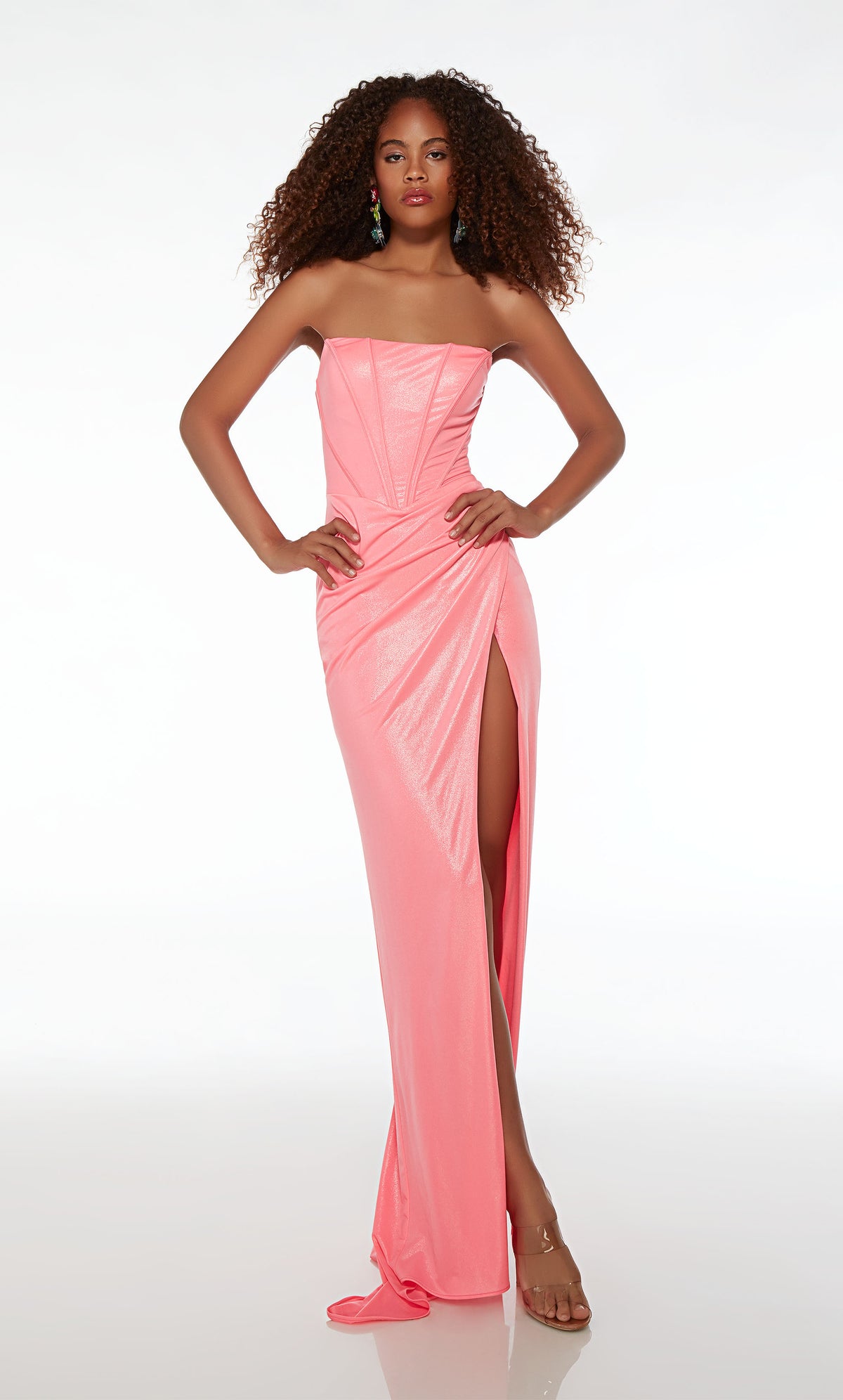Form-fitting pink prom dress with an corset top, ruching detail, side slit, and an slight train, all crafted in metallic jersey for an stylish and glamorous appeal.