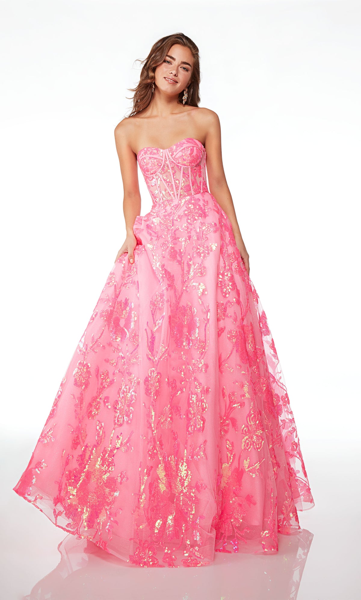 Strapless pink ball gown with an corset top, lace-up back, and iridescent sequin flowers throughout, creating an whimsical and enchanting aesthetic.