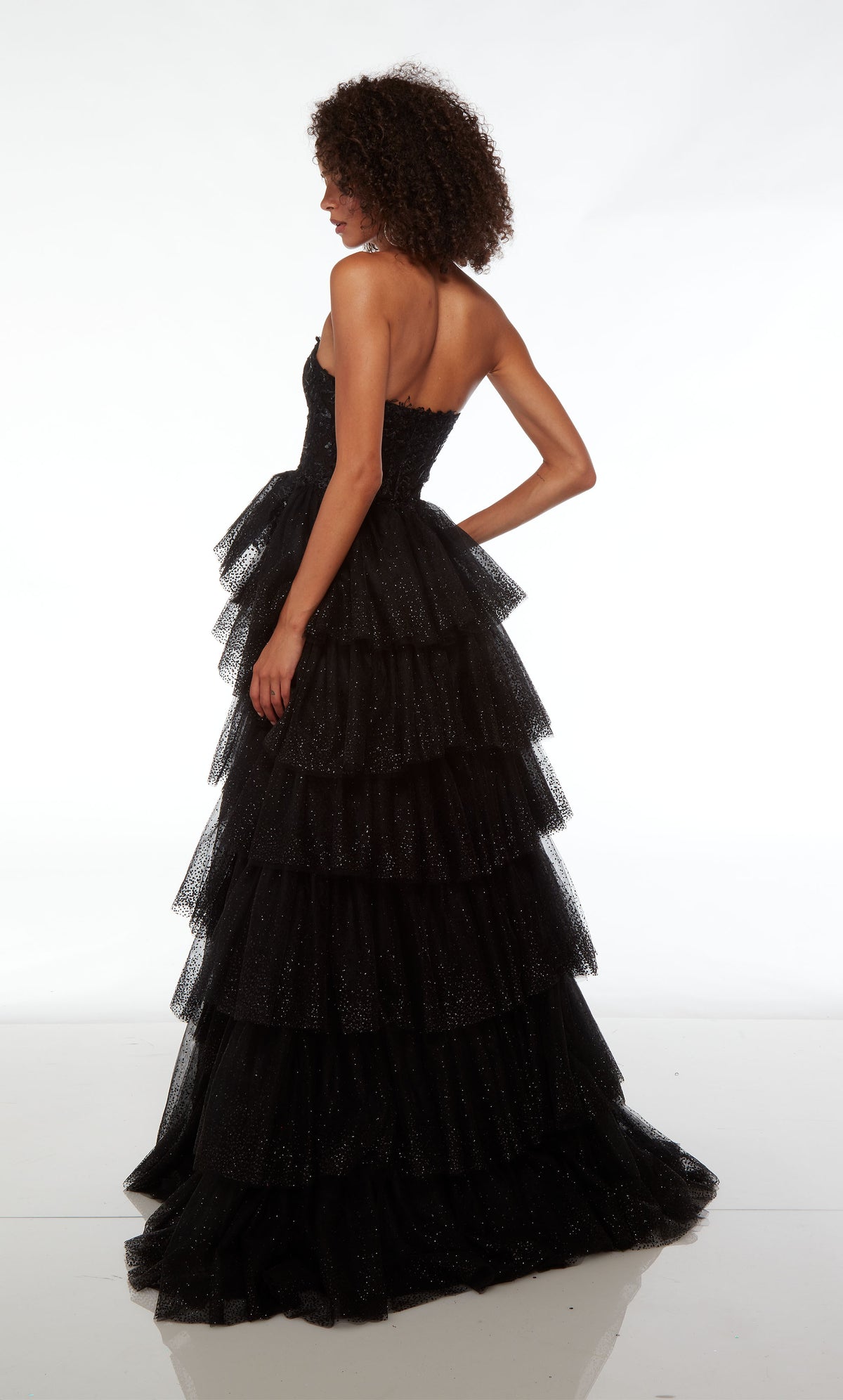 Chic black prom dress: strapless sweetheart neckline, high slit, zip-up back, slight train, and an glitter tulle ruffled skirt for an stunning look.