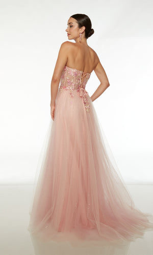 Ultra-feminine light pink prom dress: sheer strapless corset top, floral lace appliques, front slit, lace-up back, and glitter tulle train for an glamorous look.