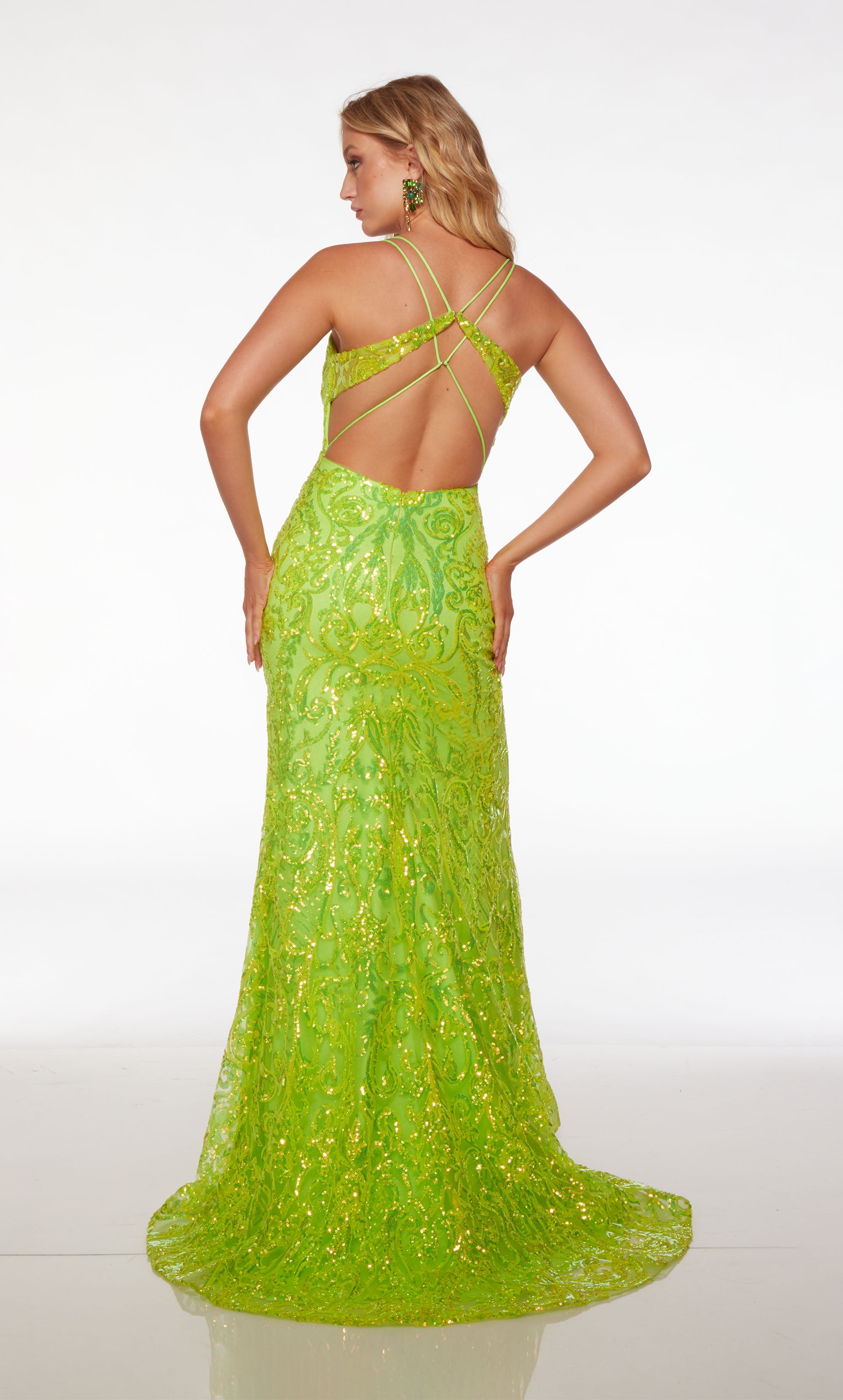 Green prom dress: form-fitting, plunging neckline, high slit, dual spaghetti straps, strappy open back, paisley sequin design, and an stylish train.