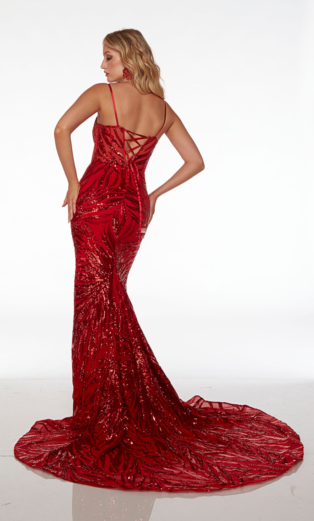 Red prom dress with an plunging neckline, spaghetti straps, lace-up back, train, and an unique sequin design throughout for an refreshing and stylish look.