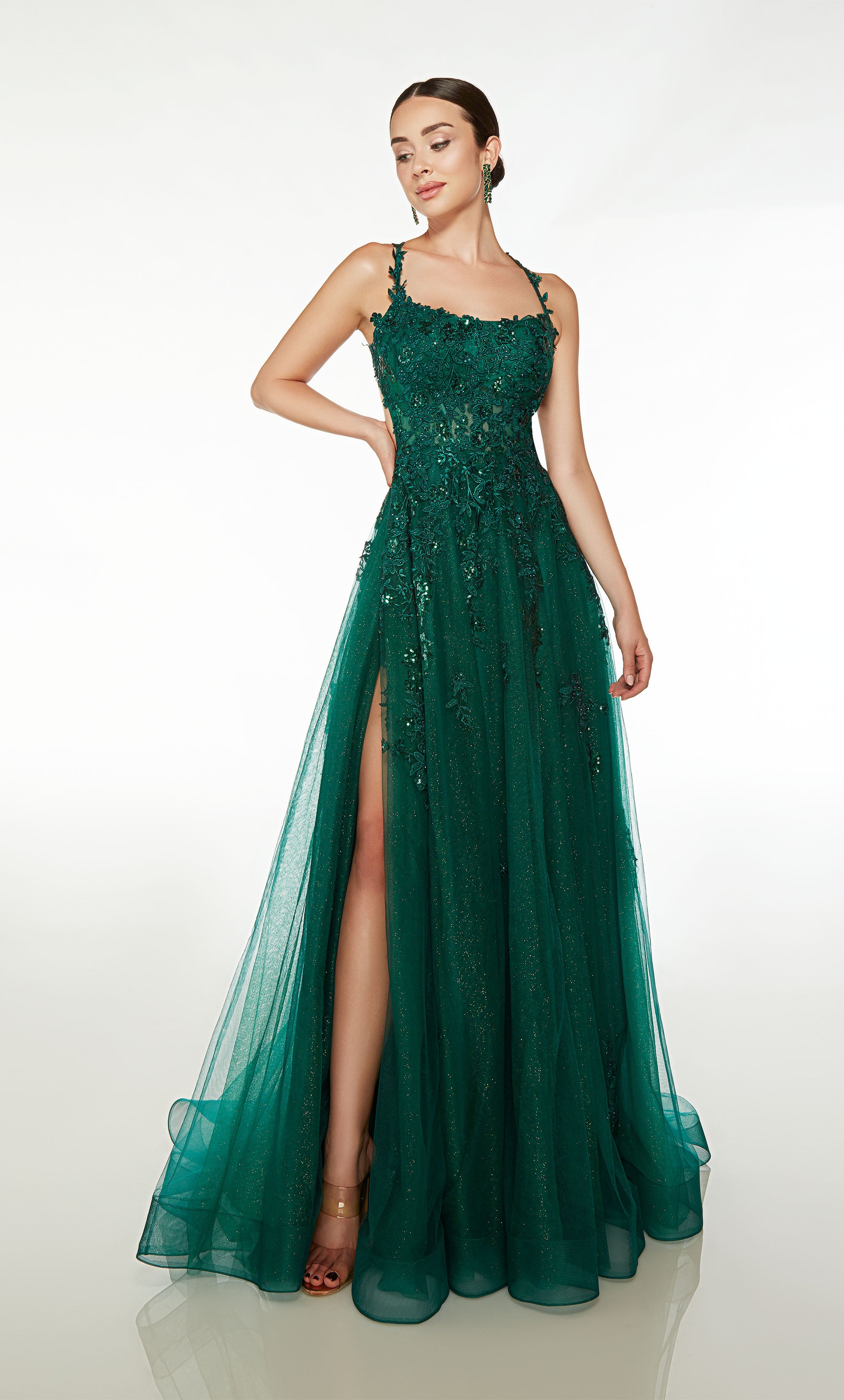 Green glitter tulle corset dress: scooped neckline, side slit, crisscross strappy back, train, and floral lace appliques for an charming look.