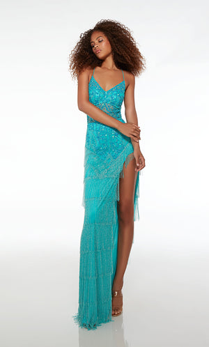 Mesmerizing Caribbean blue fringe prom dress with an V neckline, sheer bodice, high slit, crisscross lace-up back, and intricate sequin detail for an stunning and stylish look.