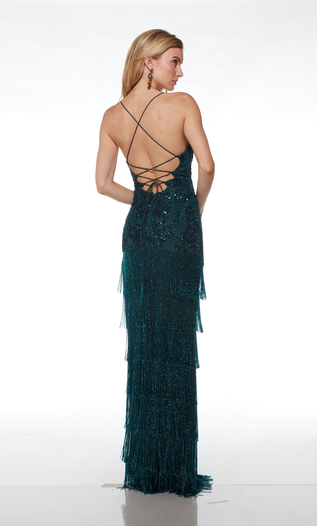Breathtaking green fringe designer dress with an V neckline, sheer bodice, high slit, crisscross lace-up back, and intricate sequin detail for an stunning and stylish look.