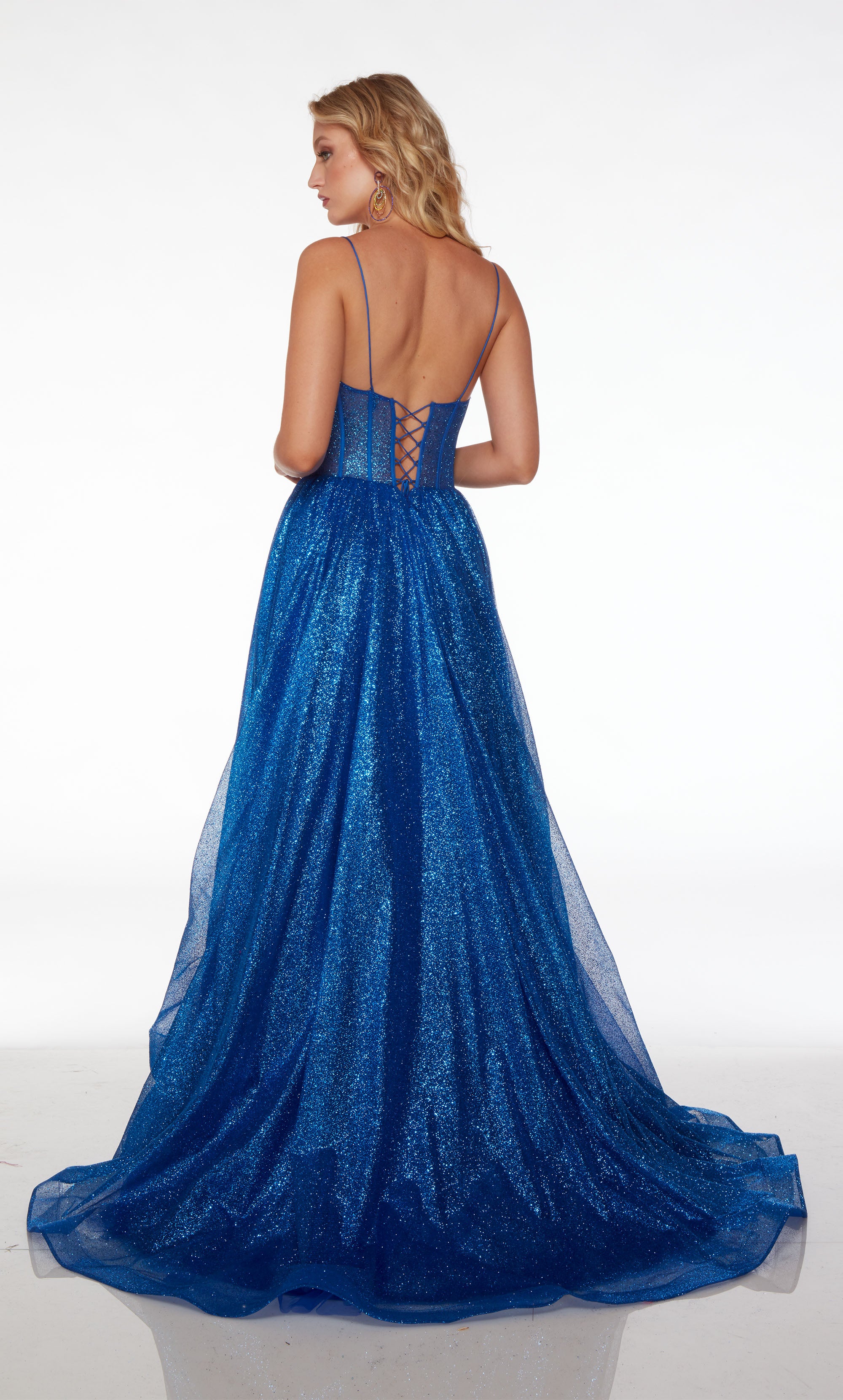 Vibrant electric blue corset dress in glitter tulle fabric, featuring an plunging neckline, high slit, lace-up back, and an long train for an stunning and stylish look.